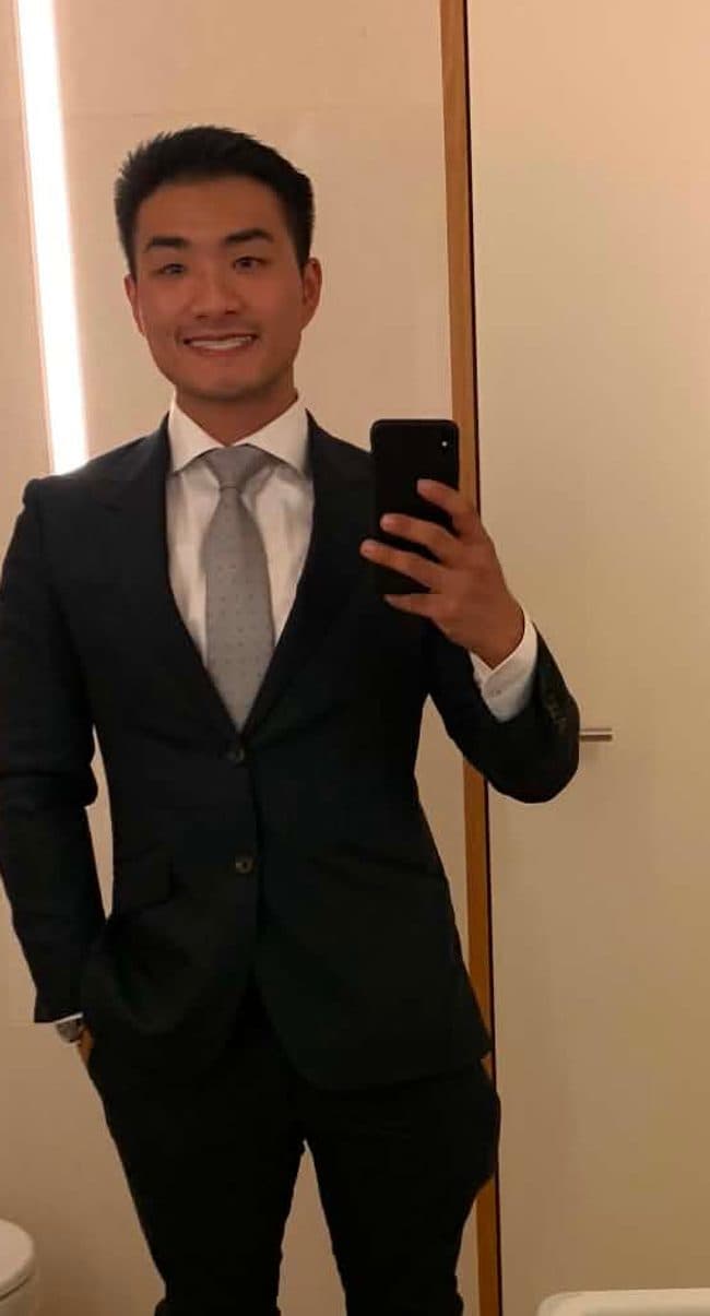 Arron in a suit, back in his corporate HR days